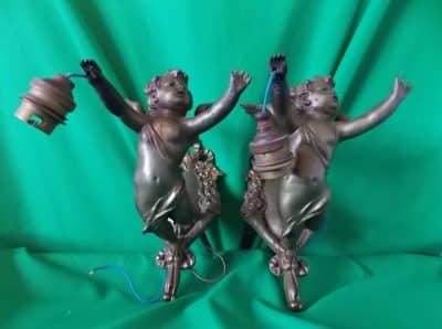 Pair early Cherub wall lights