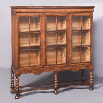 Stylish George II Style Figured Walnut Three-Door Bookcase on Stand